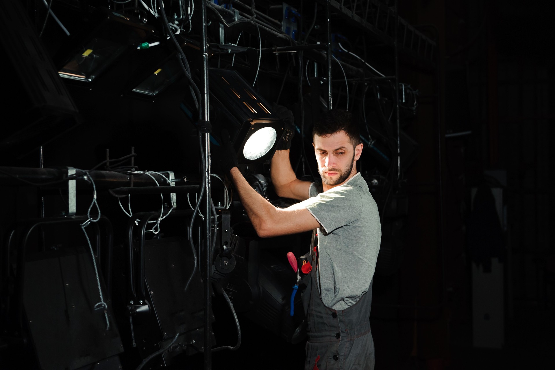 The stage worker sets up the lights